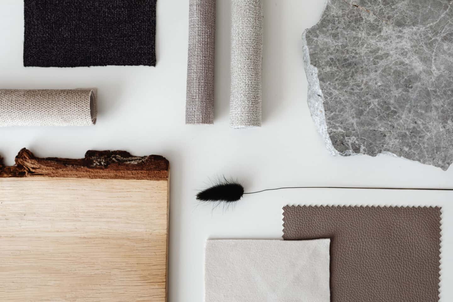 A flat lay moodboard of various interior design materials