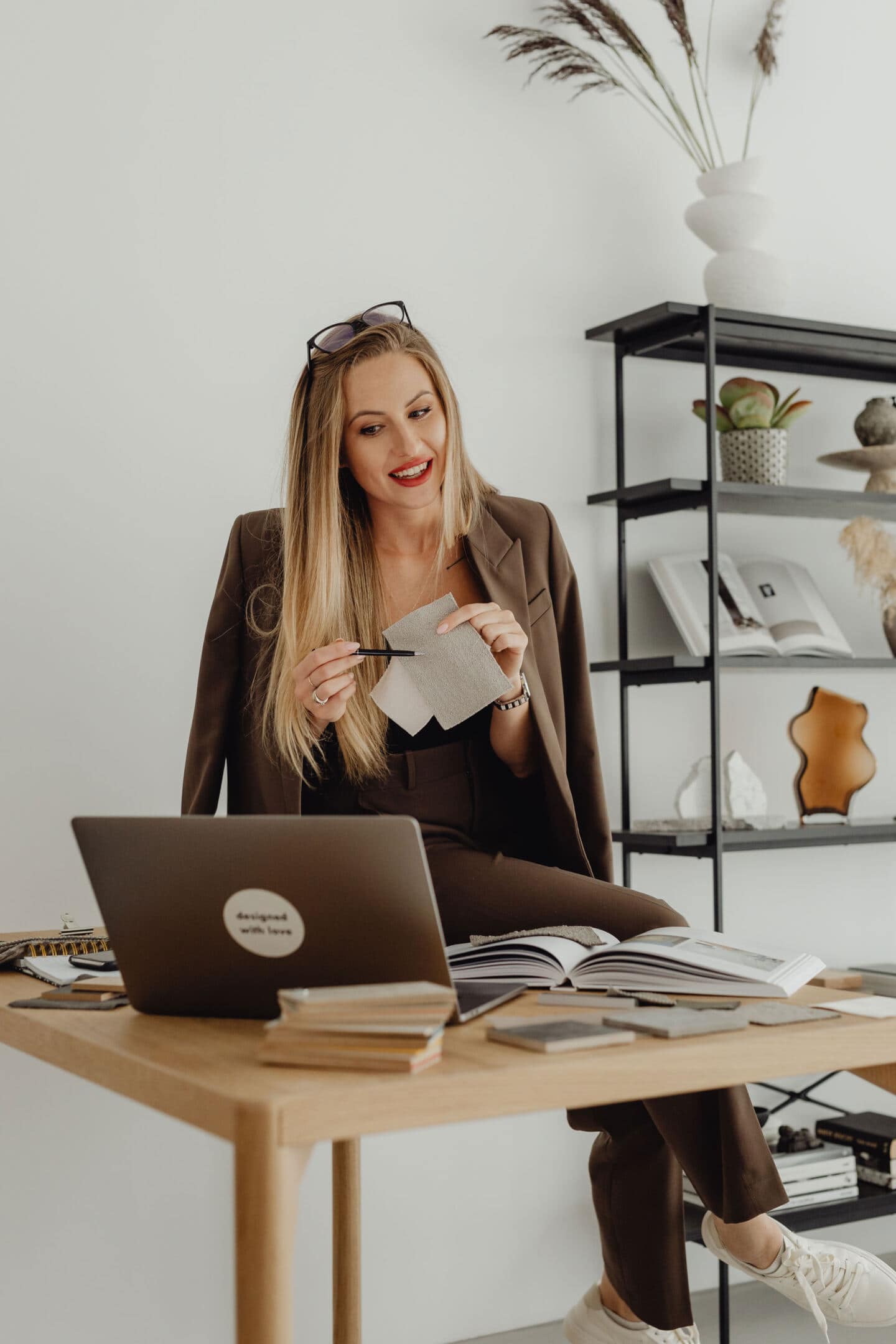 A woman sat at a desk talking on a video call sharing home renovation tips