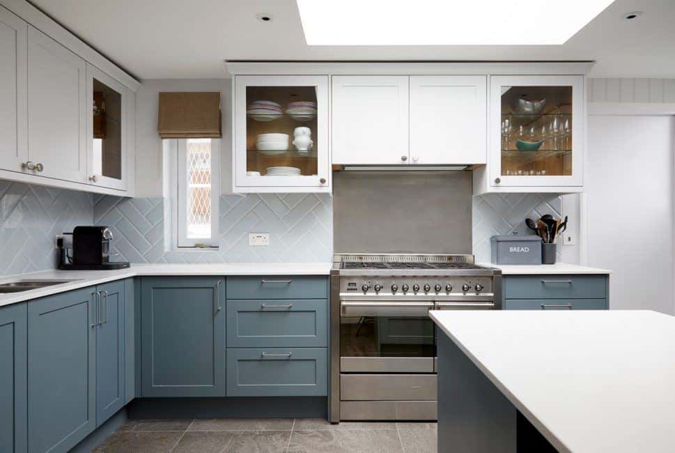 Kitchen design trends - grey lower cabinets and white upper cabinets. Design by Kia Designs