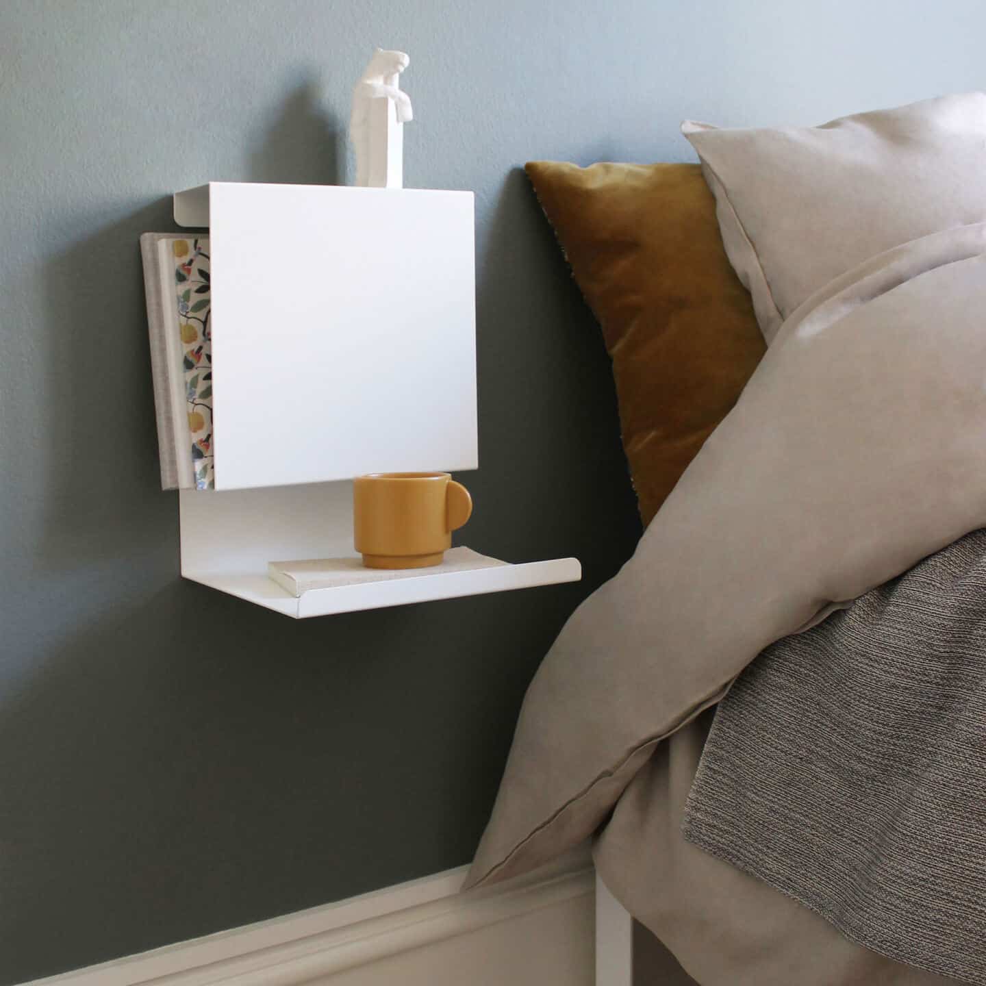 Sculptural and functional home storage solutions from Anne Linde. Bent sheet metal creates sculptural bedside tables.