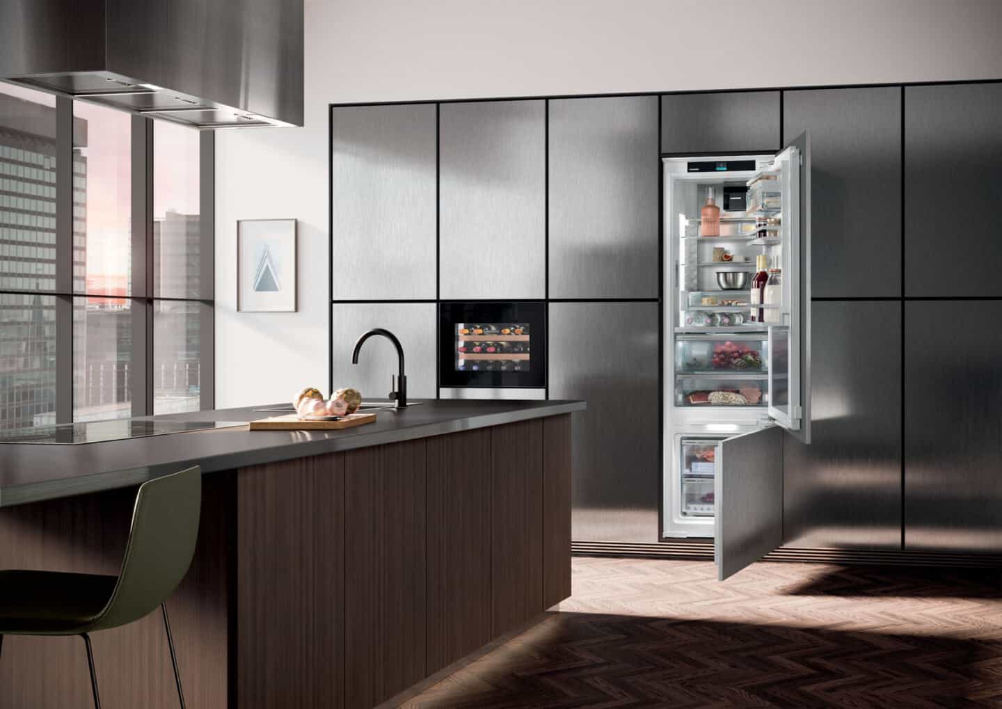 Liebherr's Fully Integrated Appliance Range. An open fridge in a modern kitchen.