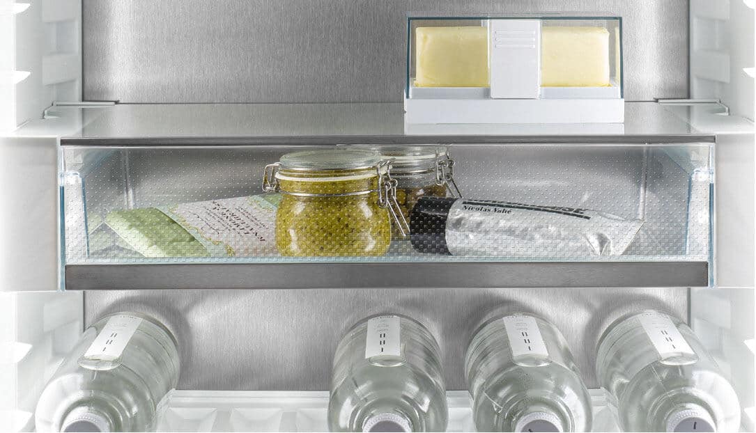 Liebherr's fully integrated appliance range. A shallow fridge drawer full of smaller food items.