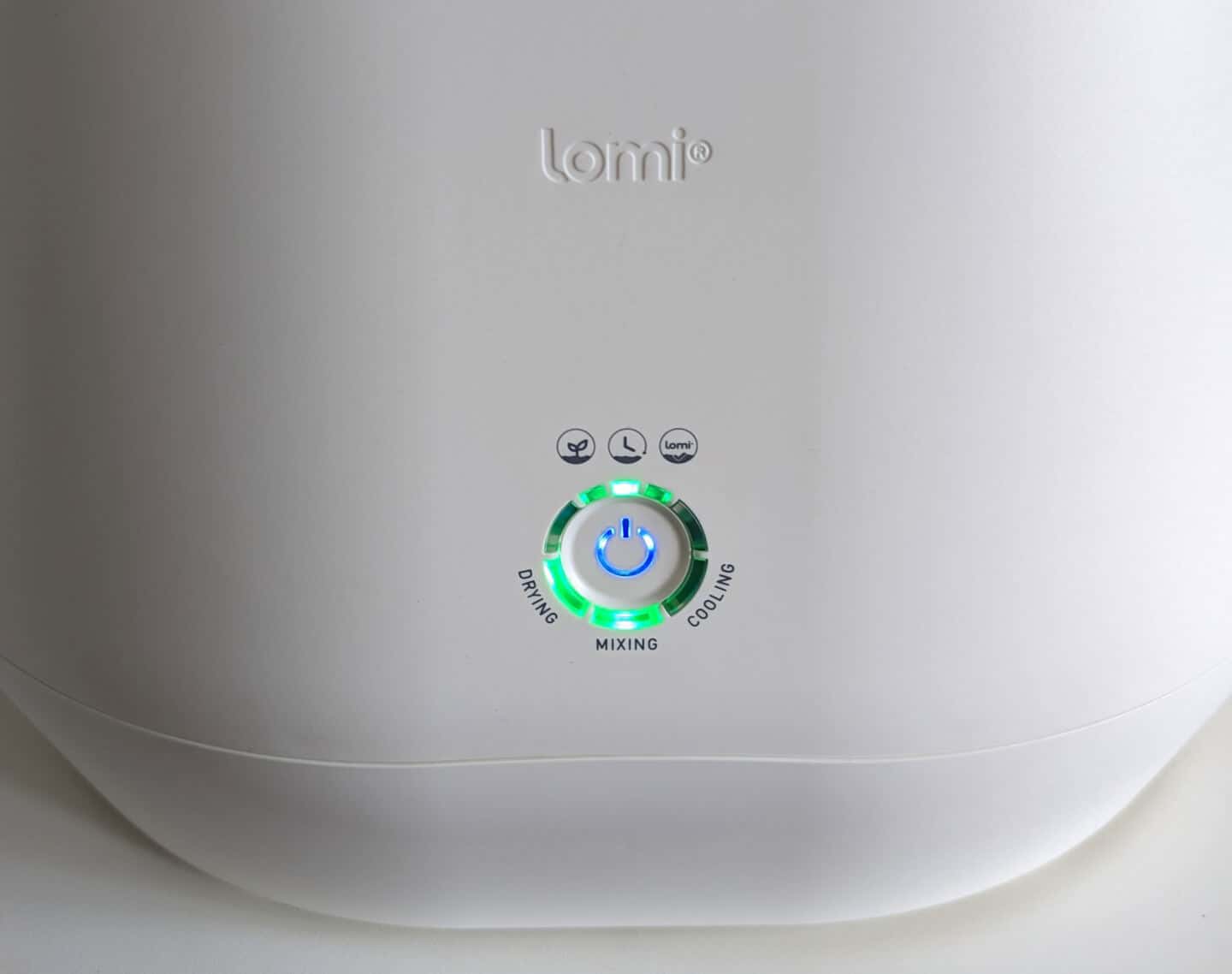 A close up of the Lomi kitchen composter controls