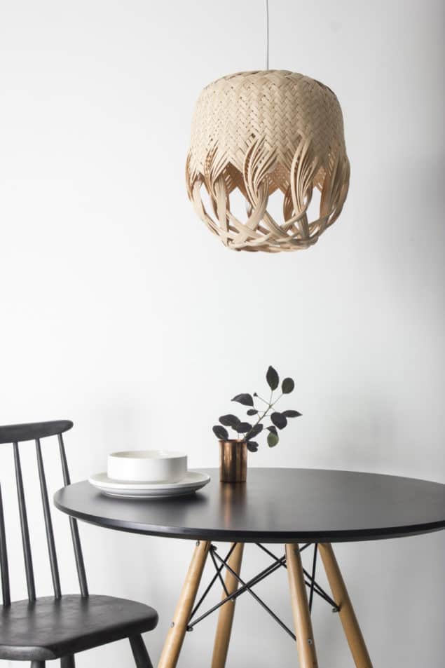 PREN lighting by Louise Tucker hanging above a small round dining table