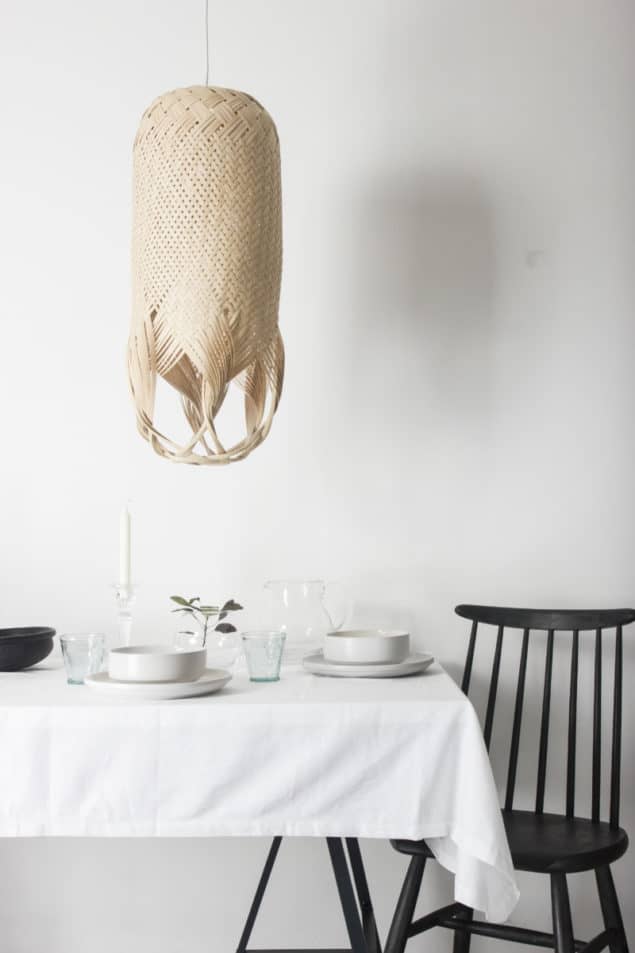 Hand woven PREN lighting by Louise Tucker suspended over dining table