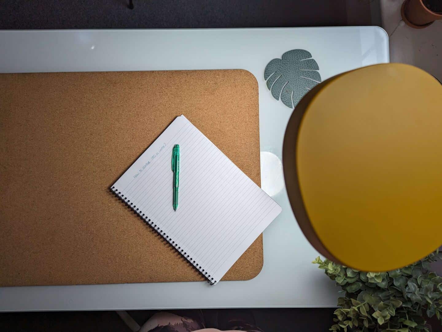 A bird's eye view of the Lumie Task Lamp over a white desk