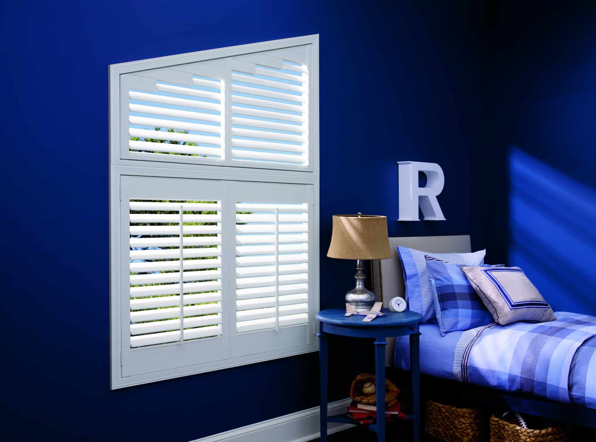 Luxaflex Faux Wood Shutter_Angled_bedroom_blue walls