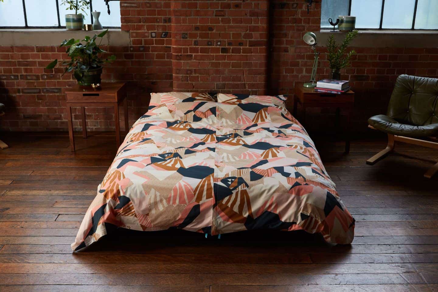 Koa revolutionary duvet cover shown in an industrial loft bedroom. The easy way to change a duvet cover