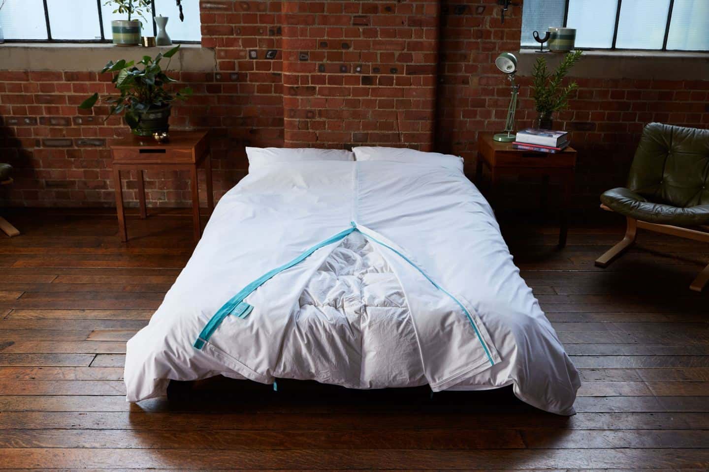 Koa revolutionary duvet cover shown in an industrial loft bedroom. The white duvet cover would be perfect for hotels. The easy way to change a duvet cover