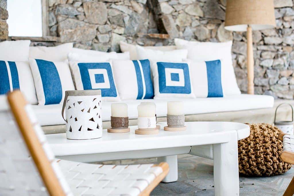 Interview with Dionas Sotiriou, co-founder of Maison Flaneur. Image of a seating area at a hotel in Greece