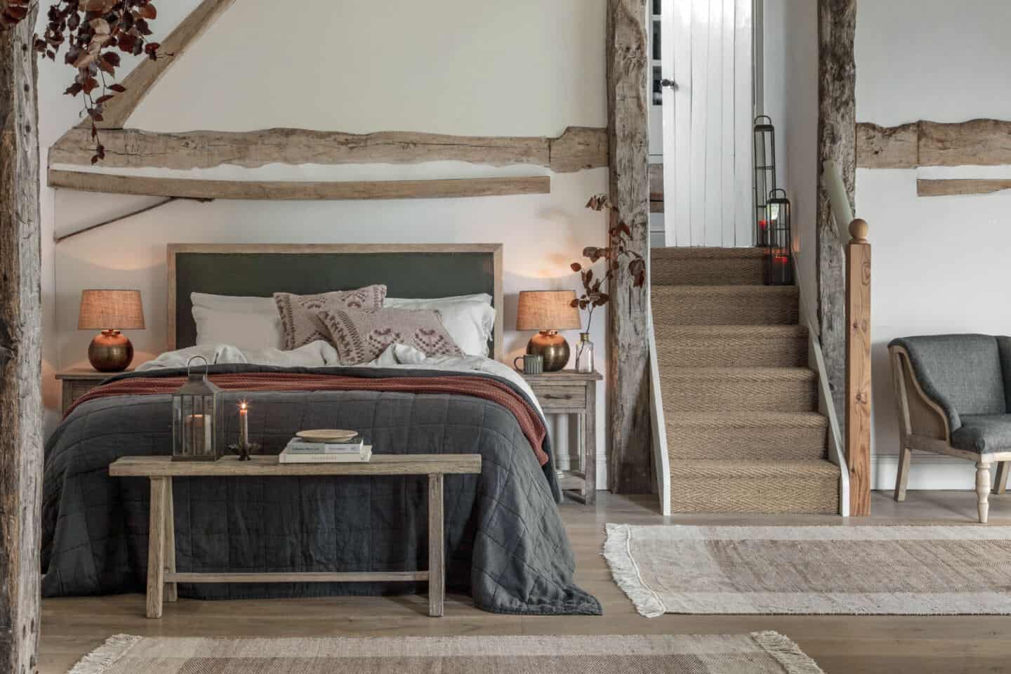 Bedroom featuring earthy neutral colours, wooden furniture and lots of natural materials and textures