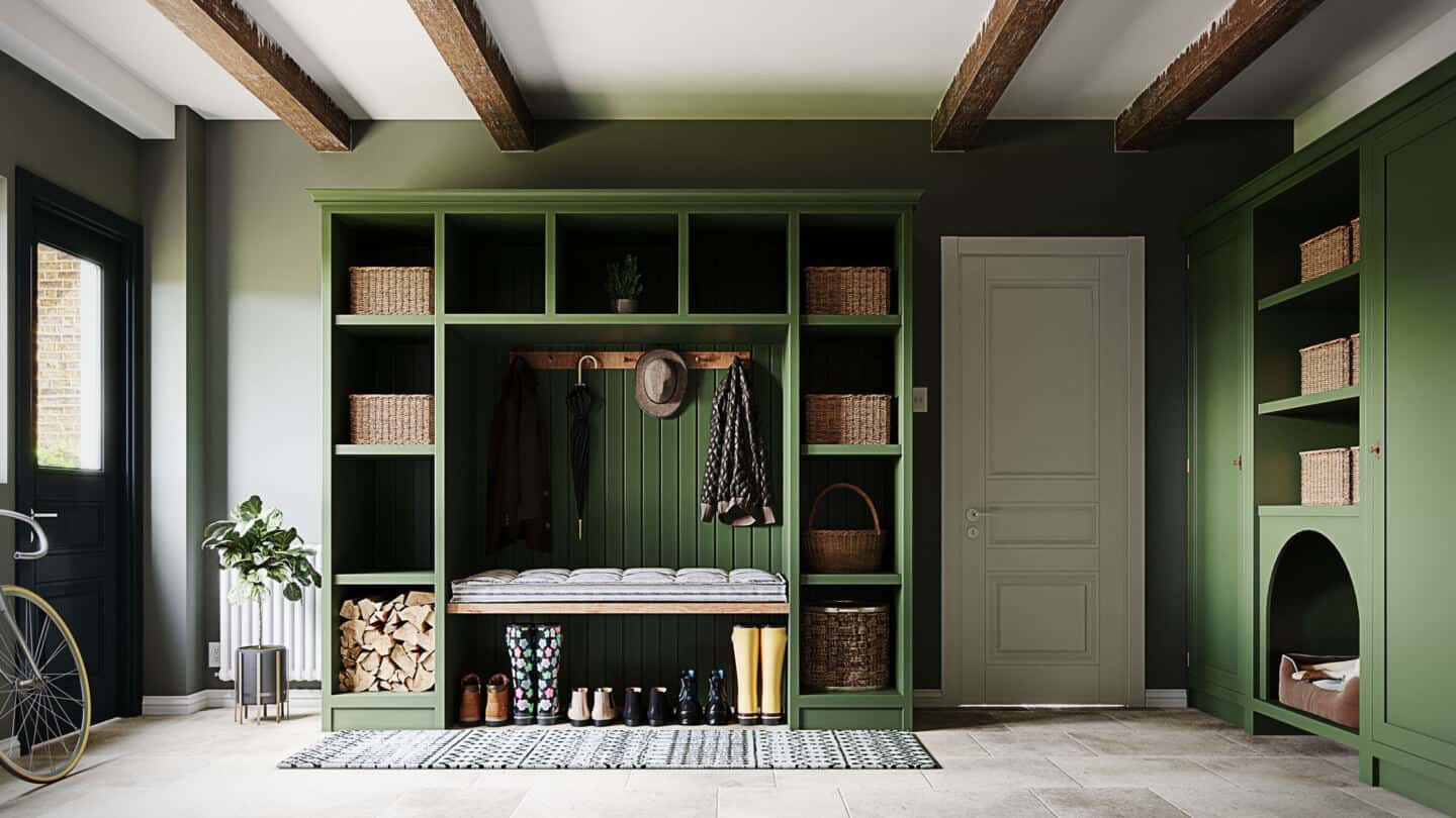 A green built-in hallway storage unit in a boot room by Olive and Barr