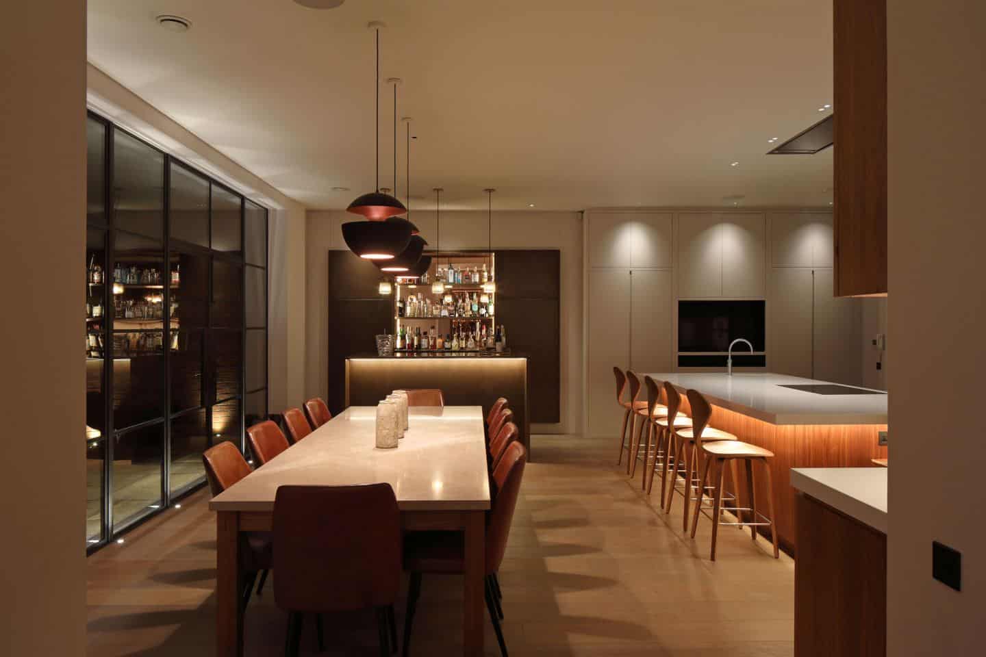 Kitchen design trends - Layered lighting in a kitchen/dining room. Lighting by John Cullen Lighting