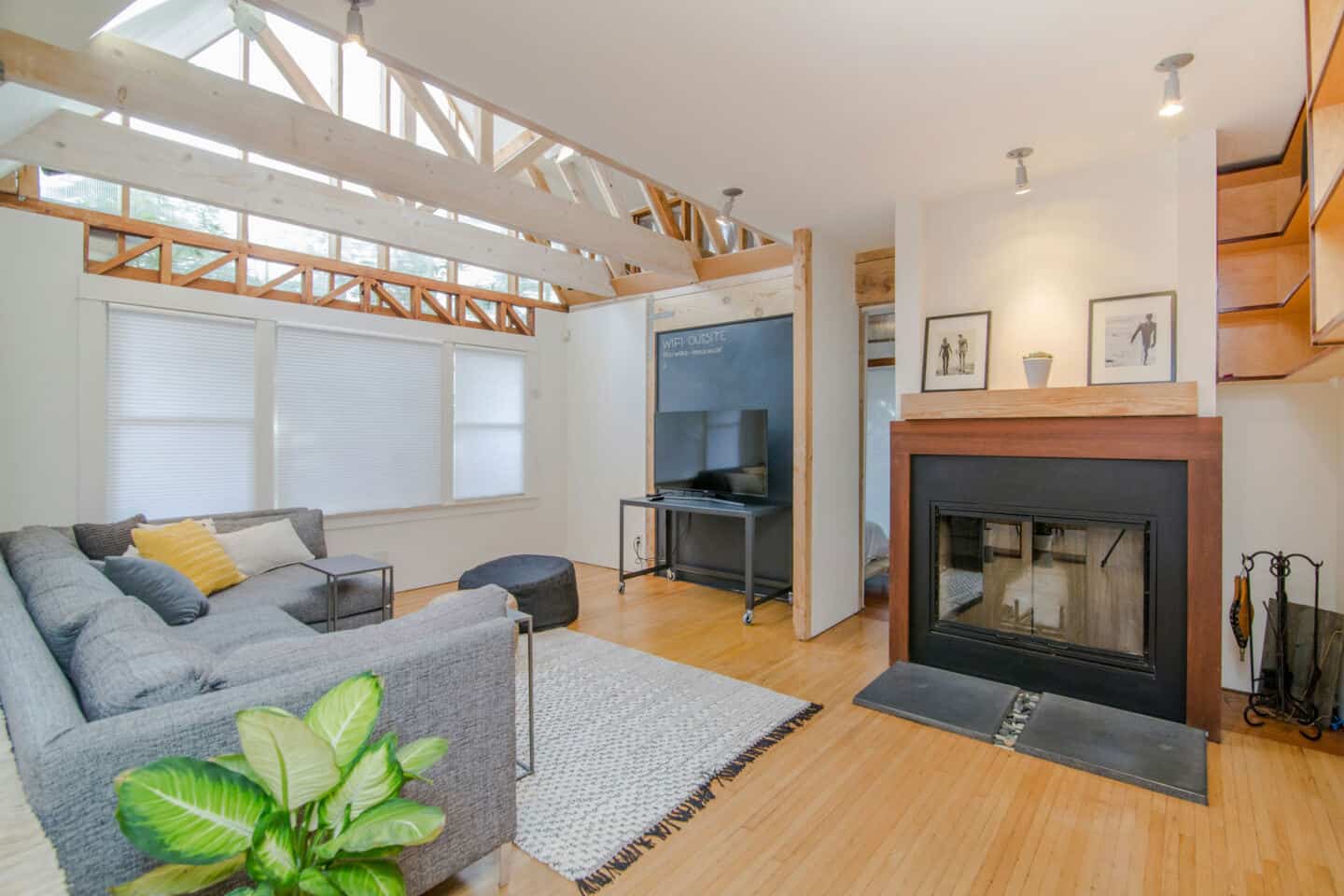 A modern home with vaulted ceiling and large fireplace