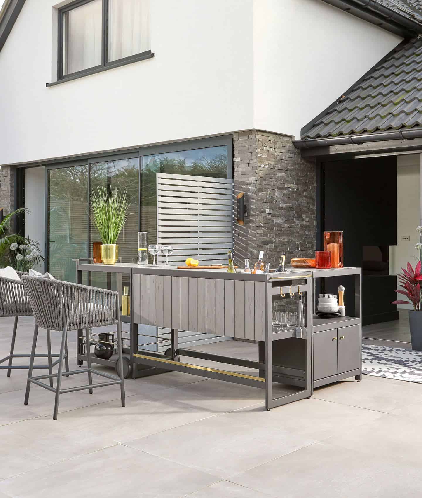 An outdoor kitchen bar makes entertaining much easier for your summer staycation in your garden