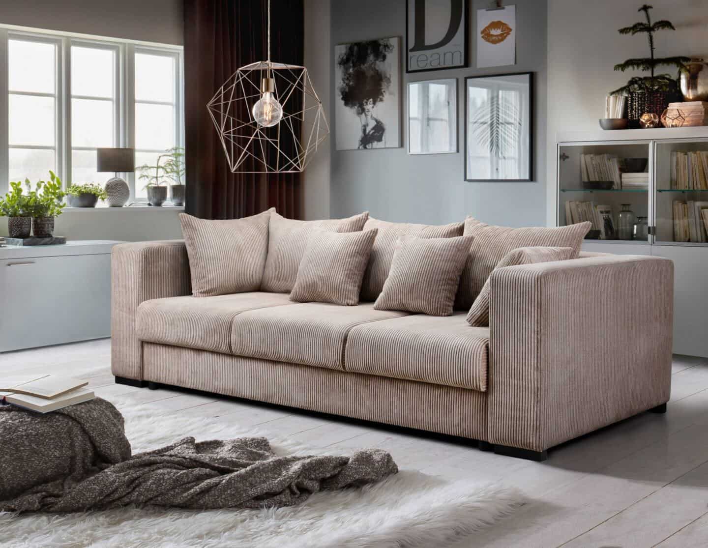 How to choose the perfect sofa for your lifestyle.  Beige Corduroy sofa in middle of room with geometric light suspended above