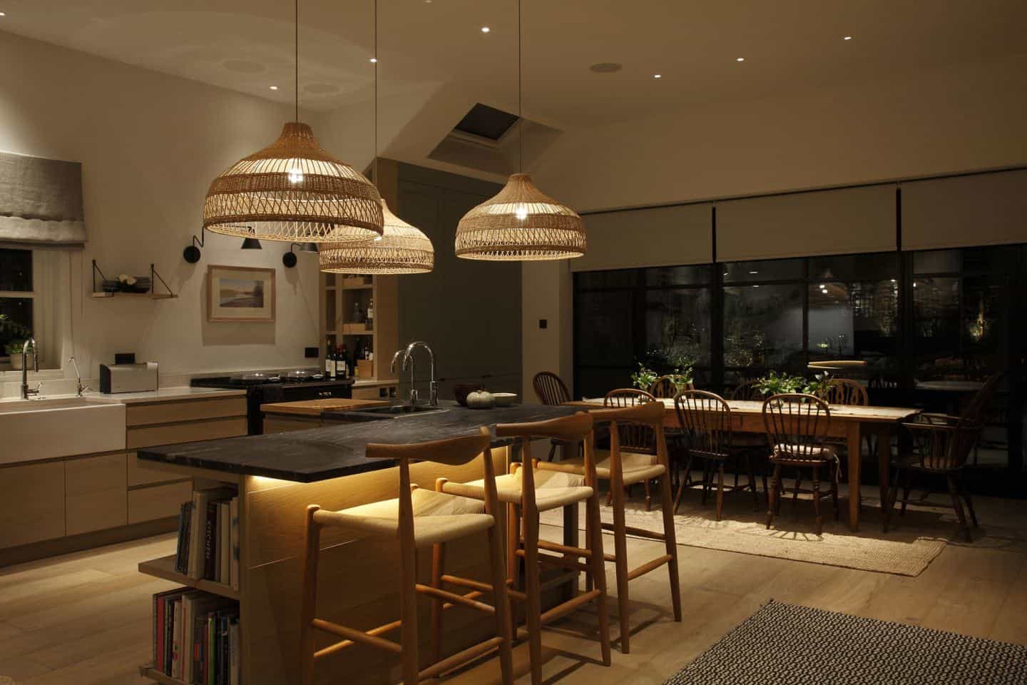 Layered lighting in an open plan space by John Cullen