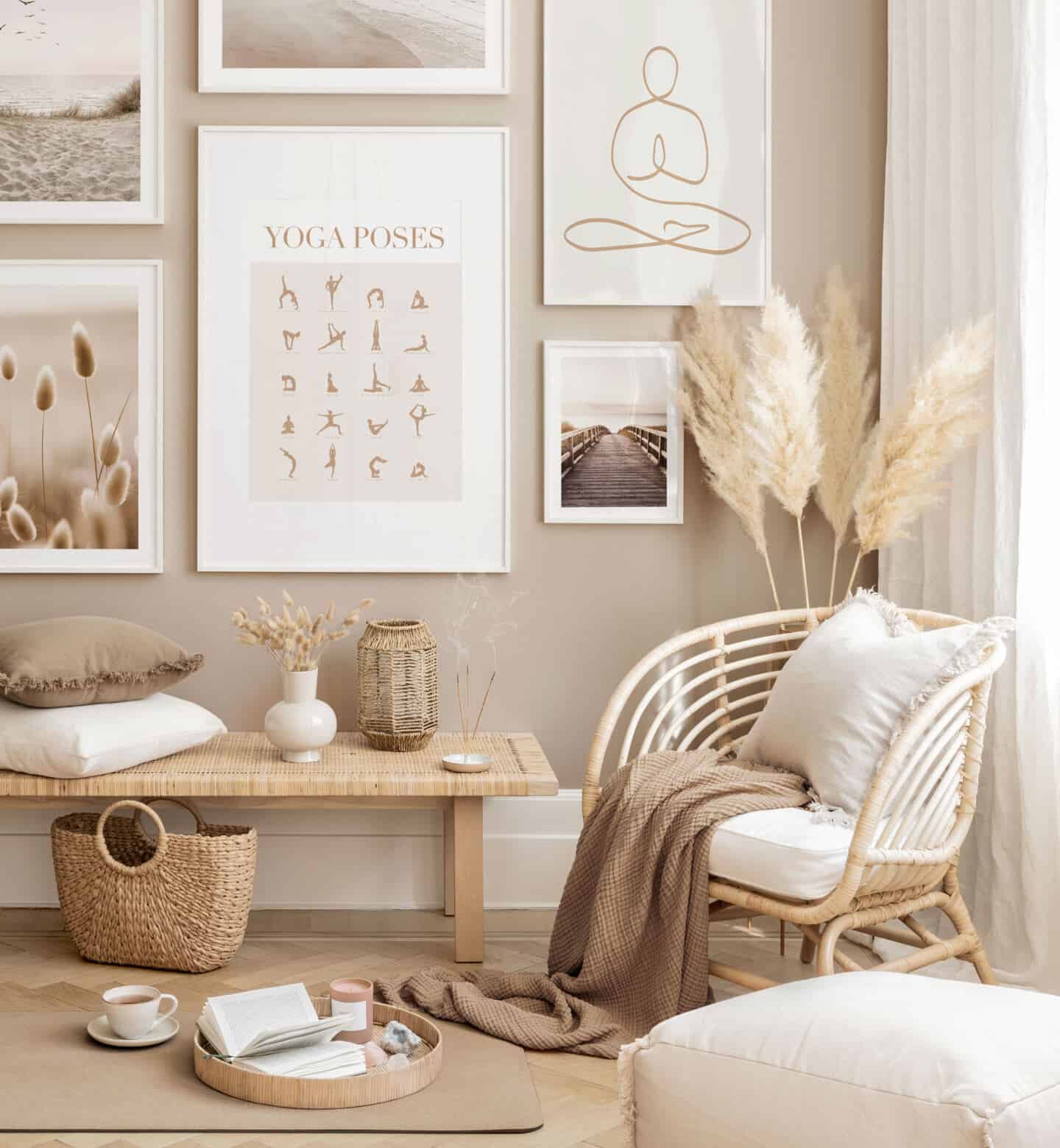 A gallery wall of sere neutral images on the wall of a yoga studio