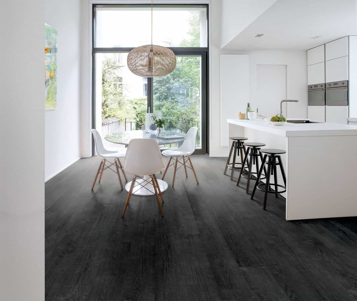 Flooring trends - quickstep flooring - black floor planks used in modern white kitchen