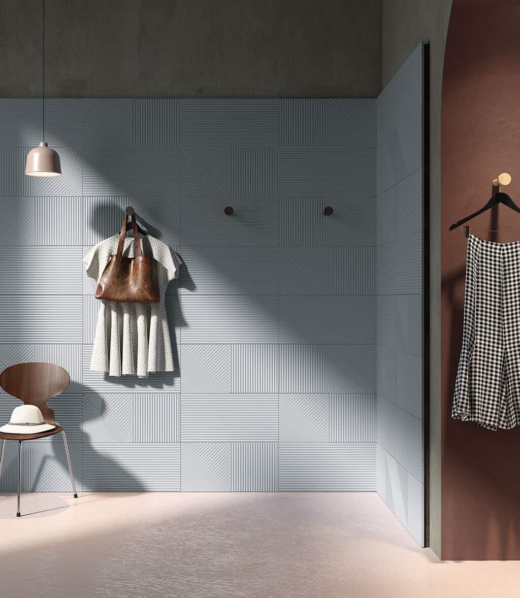 Linea textured wall tiles from European Heritage in a changing area with clothes hung on the wall