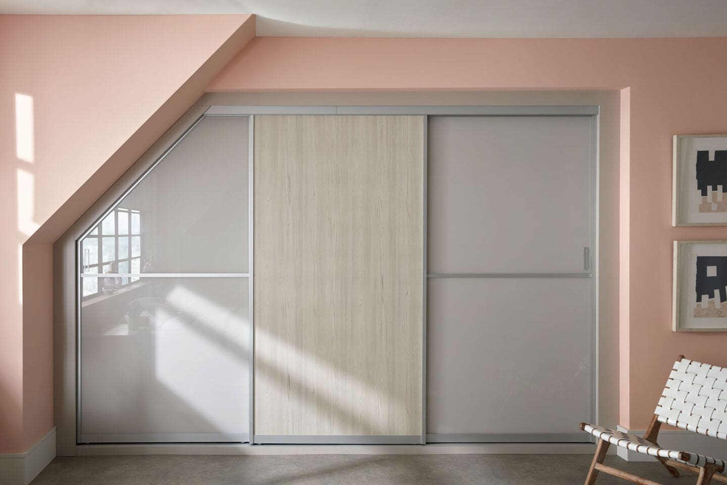 Built-in wardrobes with sliding doors in a loft space