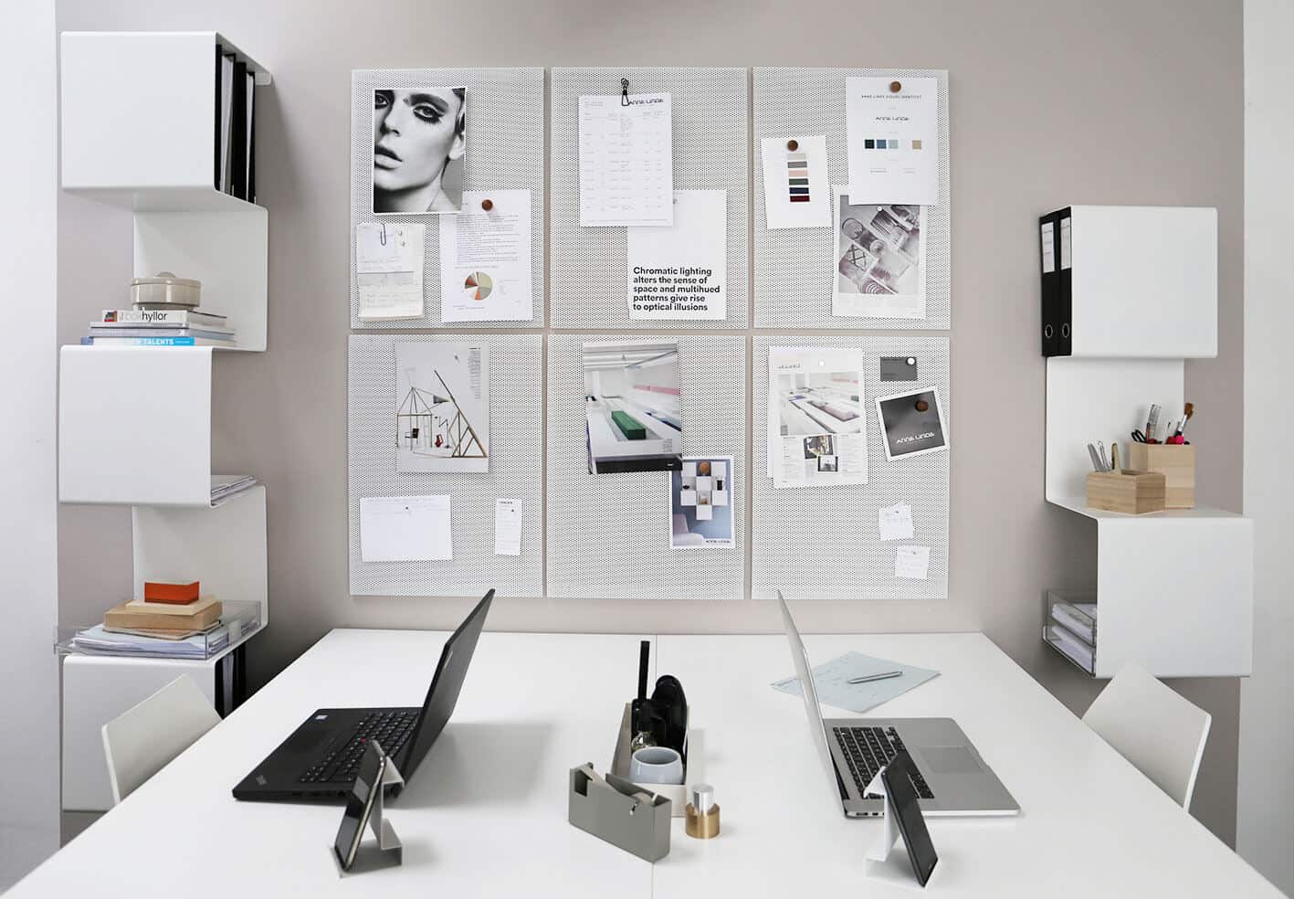 Sculptural and functional home storage solutions from Anne Linde. Bent sheet metal creates sculptural shelving units for use in a home office. Perforated sheet metal hangs on the wall as a notice board