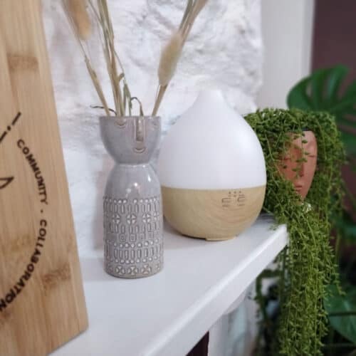 aroma diffuser on a shelf adding scents to improve home health