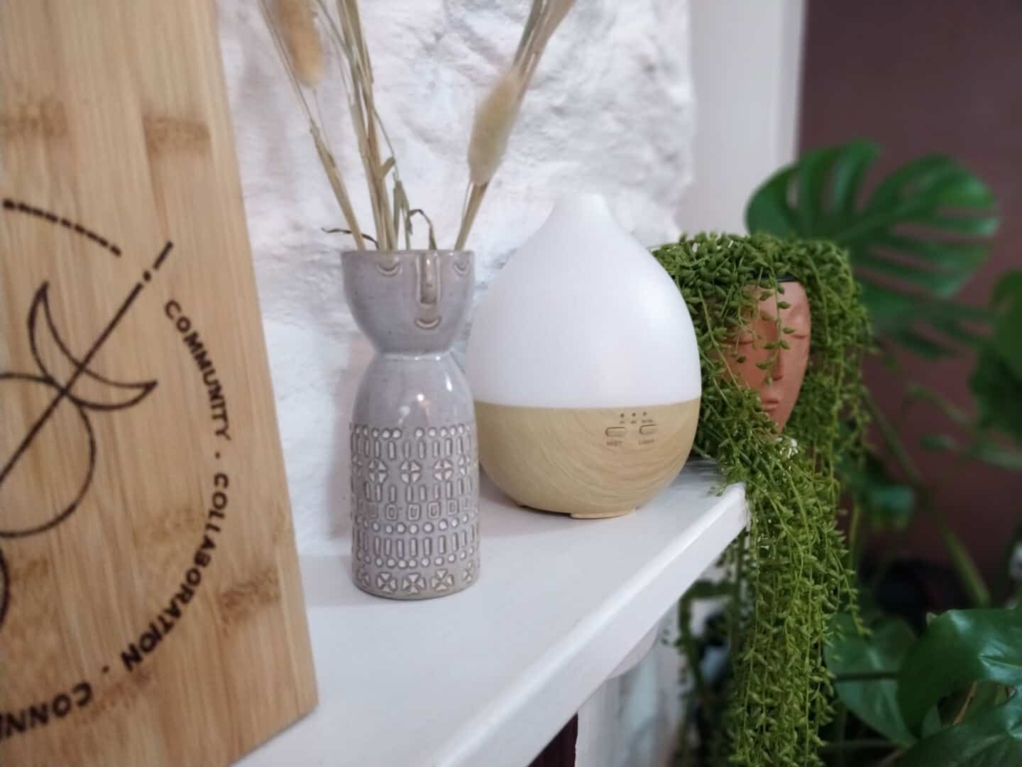 aroma diffuser on a shelf adding scents to improve home health