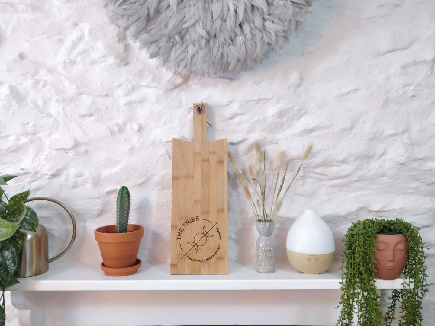 A mantle full of plants and vases