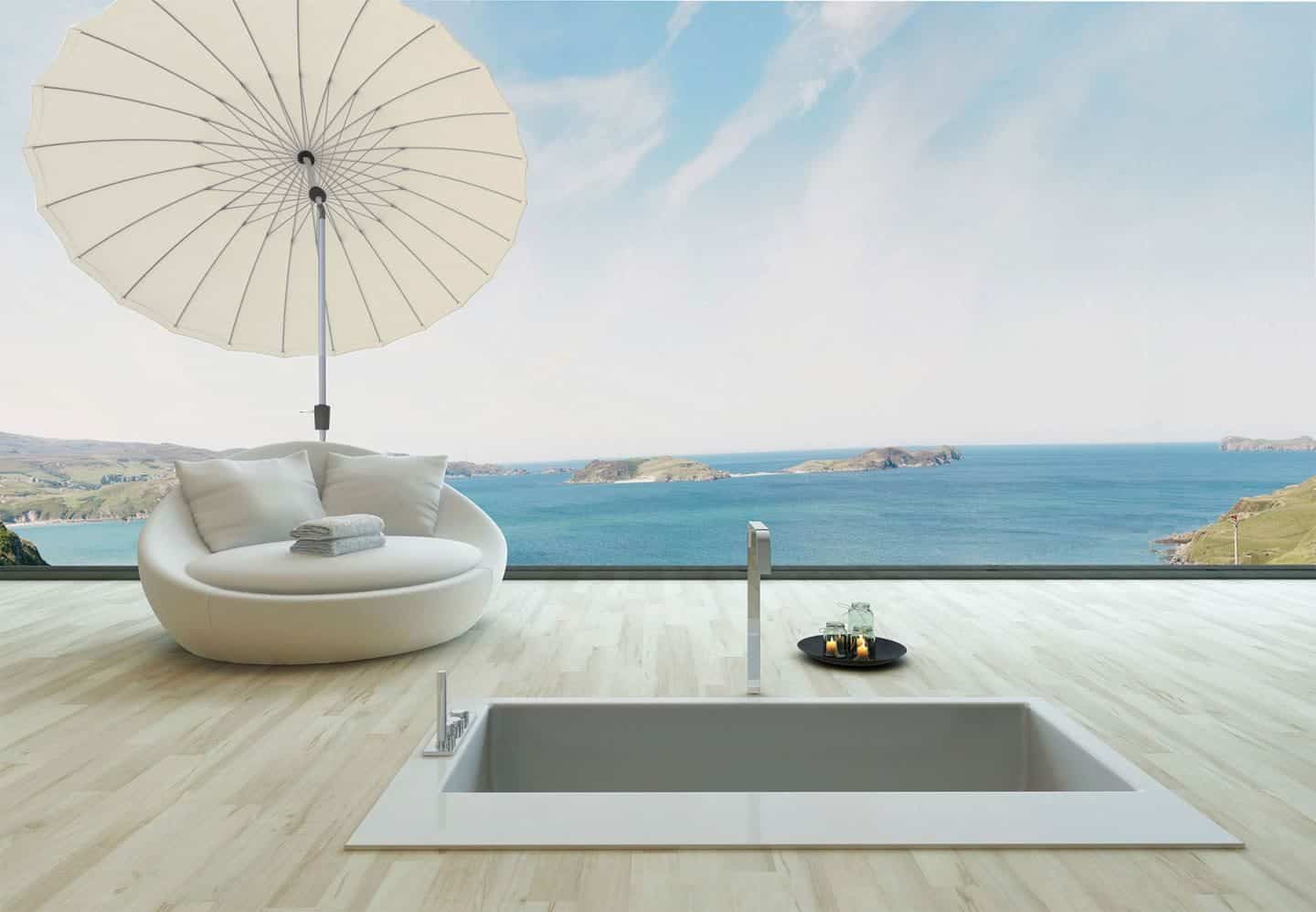 Garden Parasol from Solero Parasols. Large round white garden parasol angled above an outdoor loungen chair 