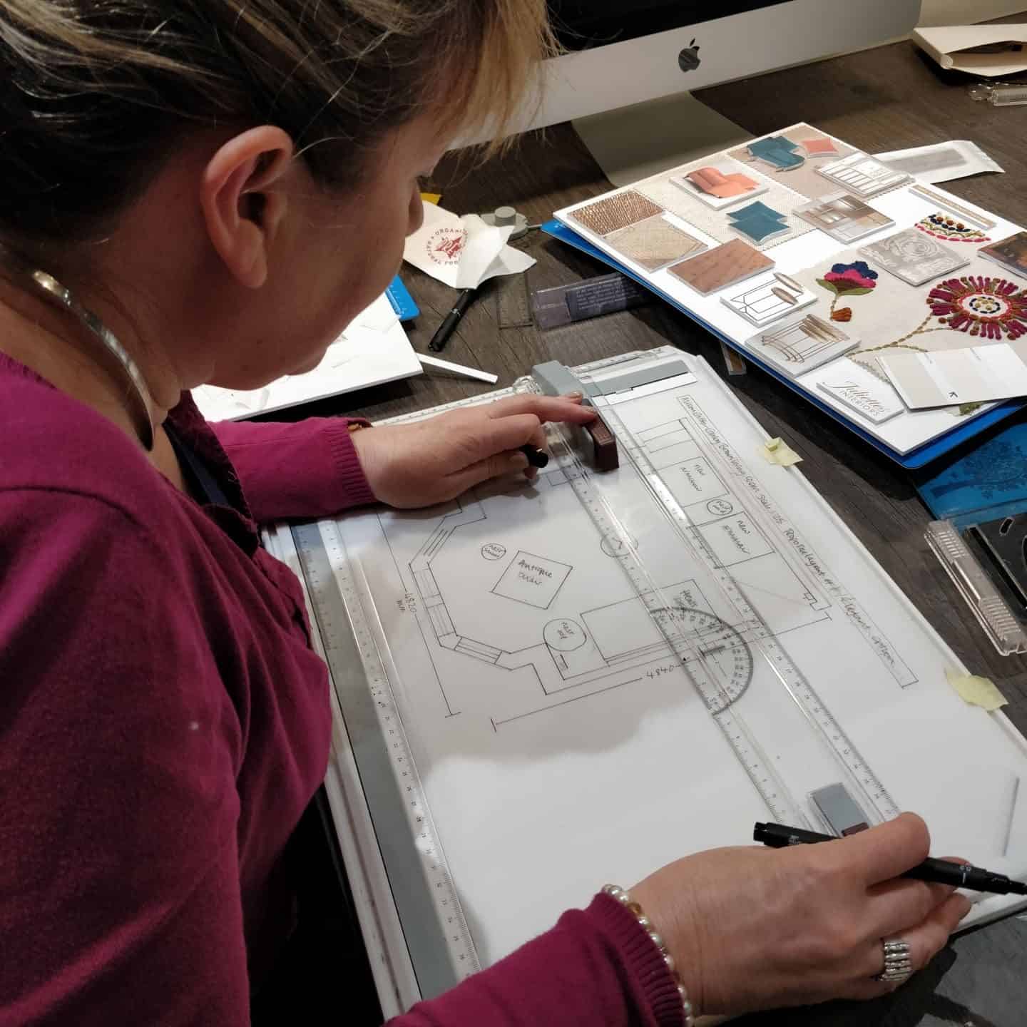 Drawing up scale floor plans at Juliette's interior design school in London