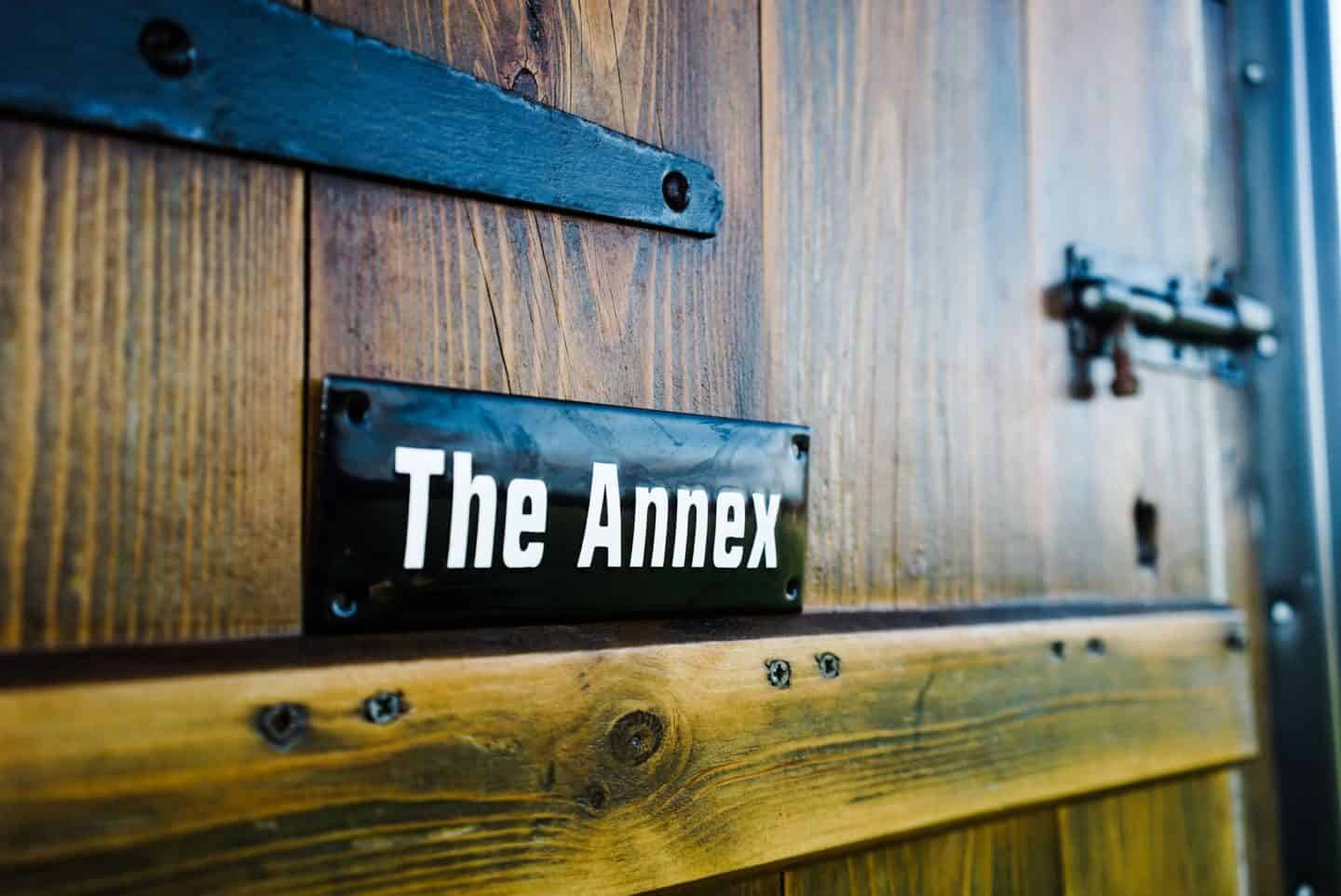 Close up of an enamel sign on a traditional British Shepherd's hut