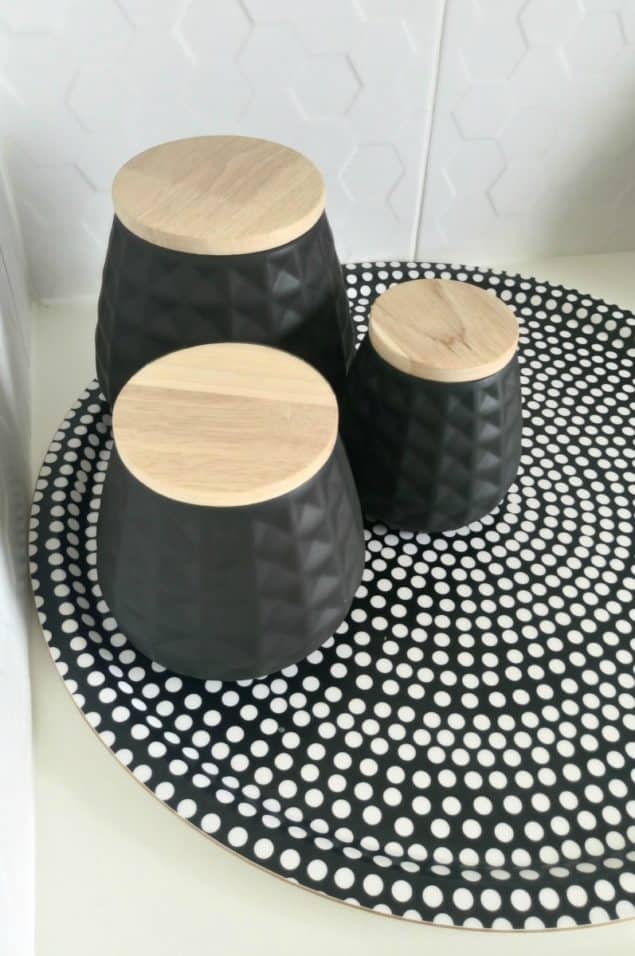 The Design Sheppard Kitchen Makeover featuring geometric patterned black storage jars from Mia Fleur and geometric tray from Marimekko