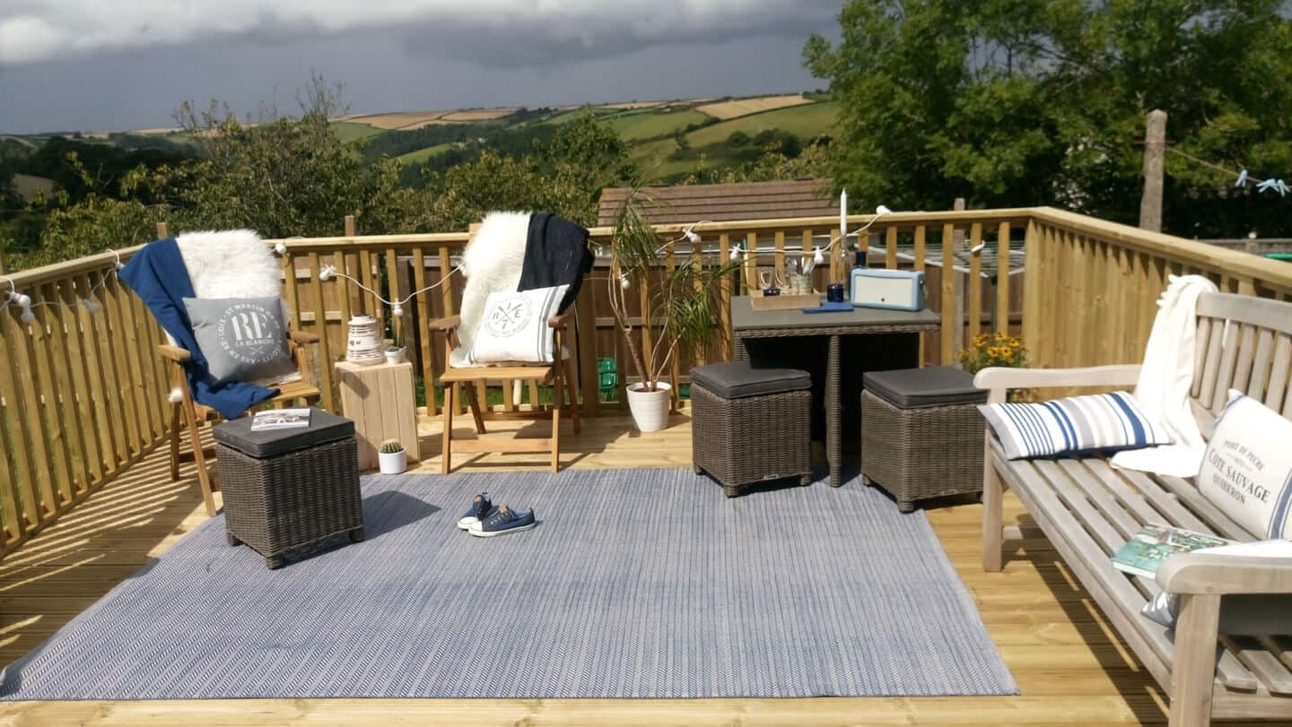 Seating area on garden decking with a nautical theme