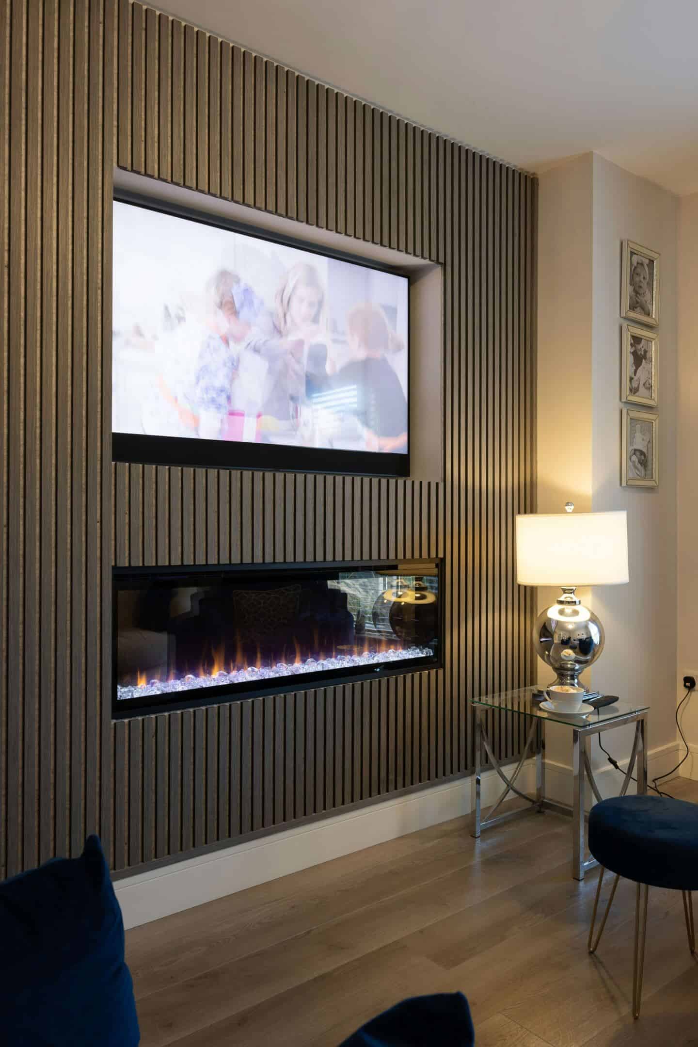 A media wall fireplace with electric fire and TV