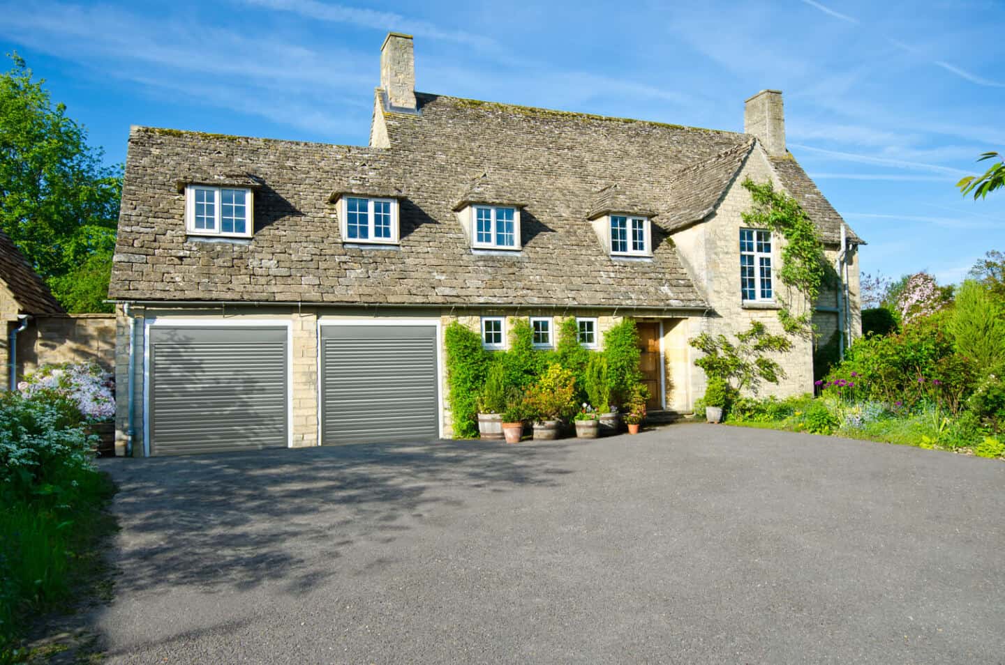 A traditional home with double garage doors