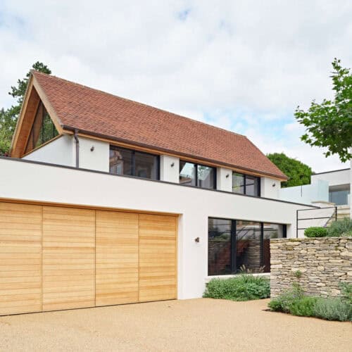 A modern home with bi-fold wooden garage doors