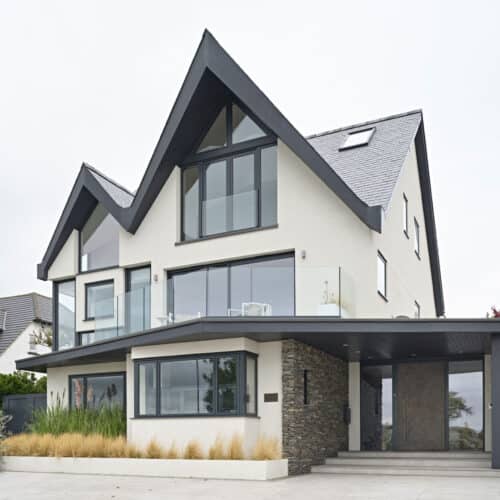 A detached house with covered entryway and pitched roof