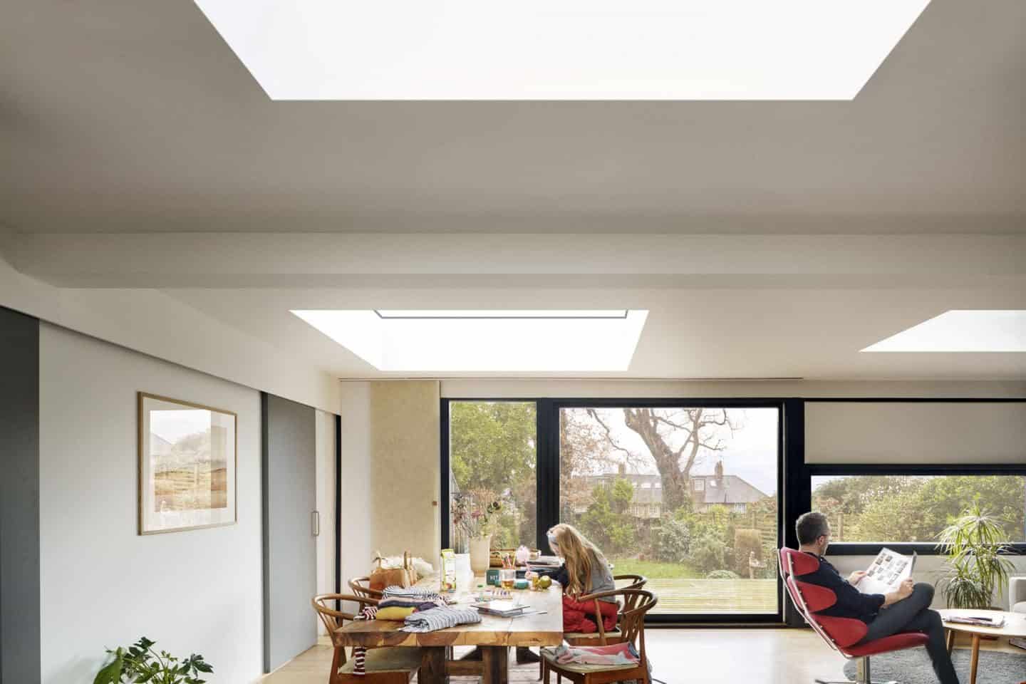 Vario by VELUX Bespoke Flat Roof Windows pictured above an open plan lounge diner