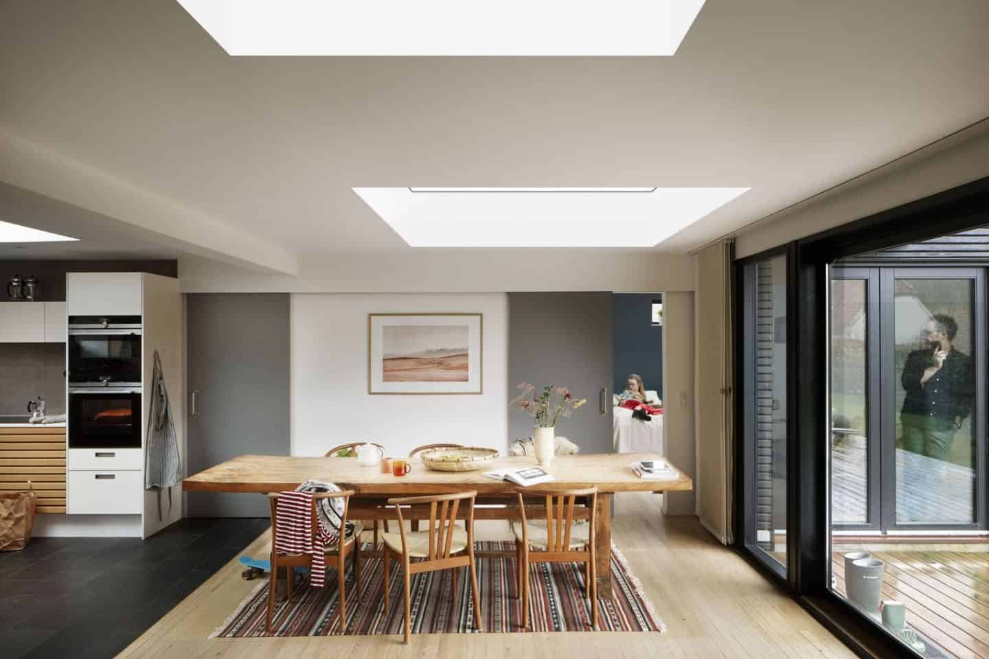 Vario by VELUX Bespoke Flat Roof Windows pictured above a large wooden dining table