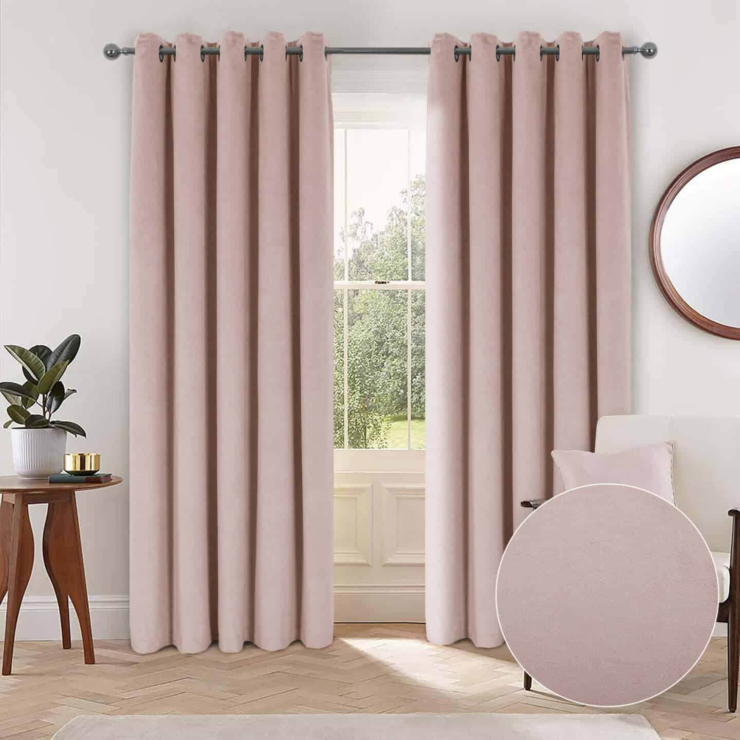 Blush pink thermal curtains hanging in a period living room