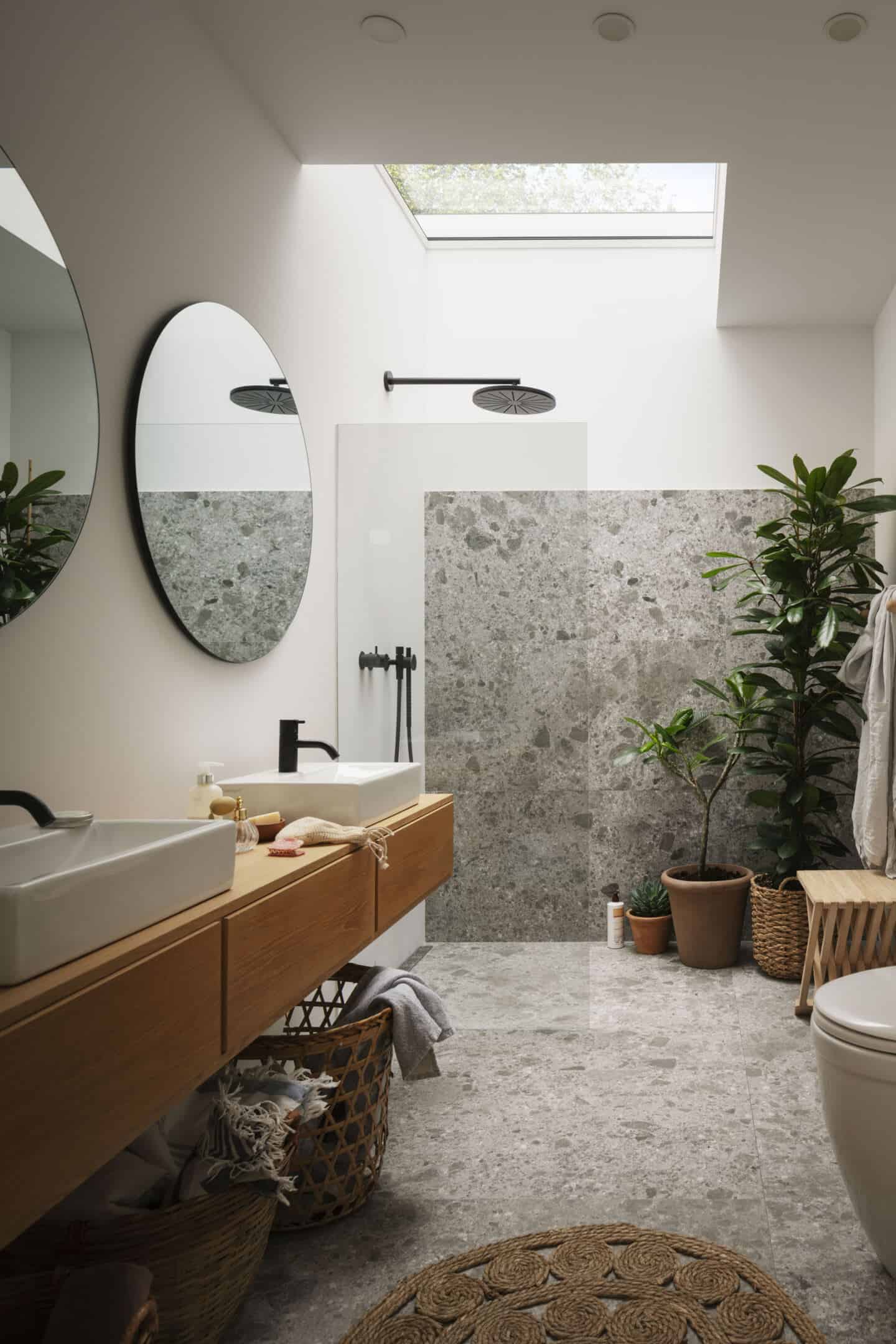 Natural light flows into this bathroom from a roof light above the shower