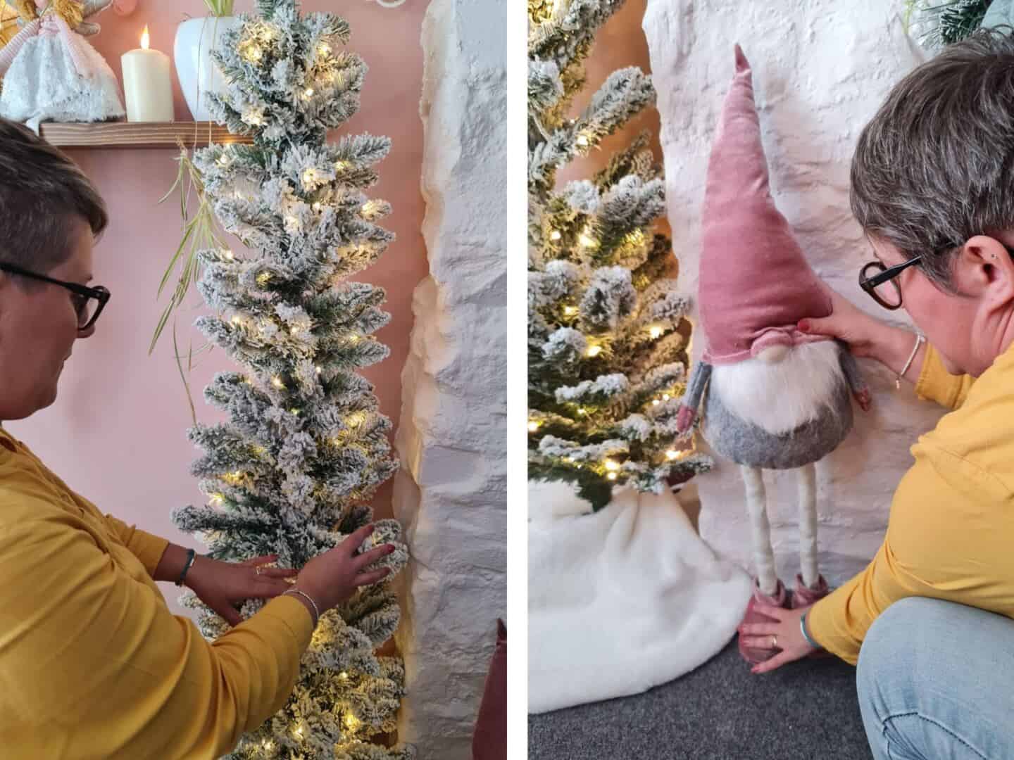 A woman fluffs up a flocked Christmas tree and places a gonk on the floor next to it