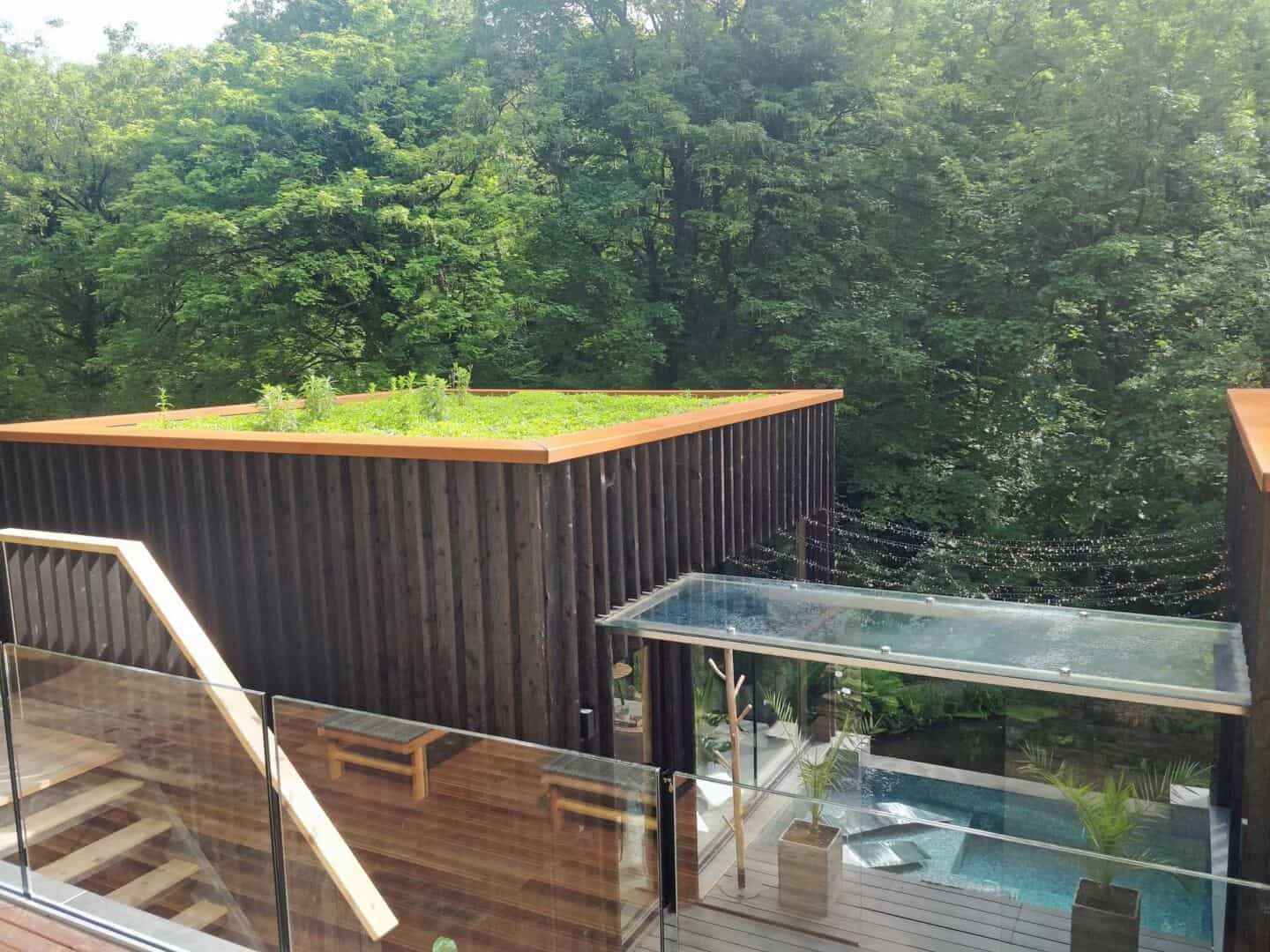 The view of the covered walkway and infinity pool from the upper deck of the Wildwood Spa in North Devon