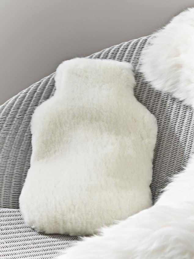 Create a cosy winter home with this Sheepskin Hot Water Bottle Cover from Cox & Cox