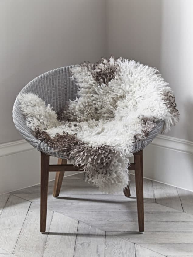 Create a cosy winter home with a Curly Sheepskin from Cox & Cox